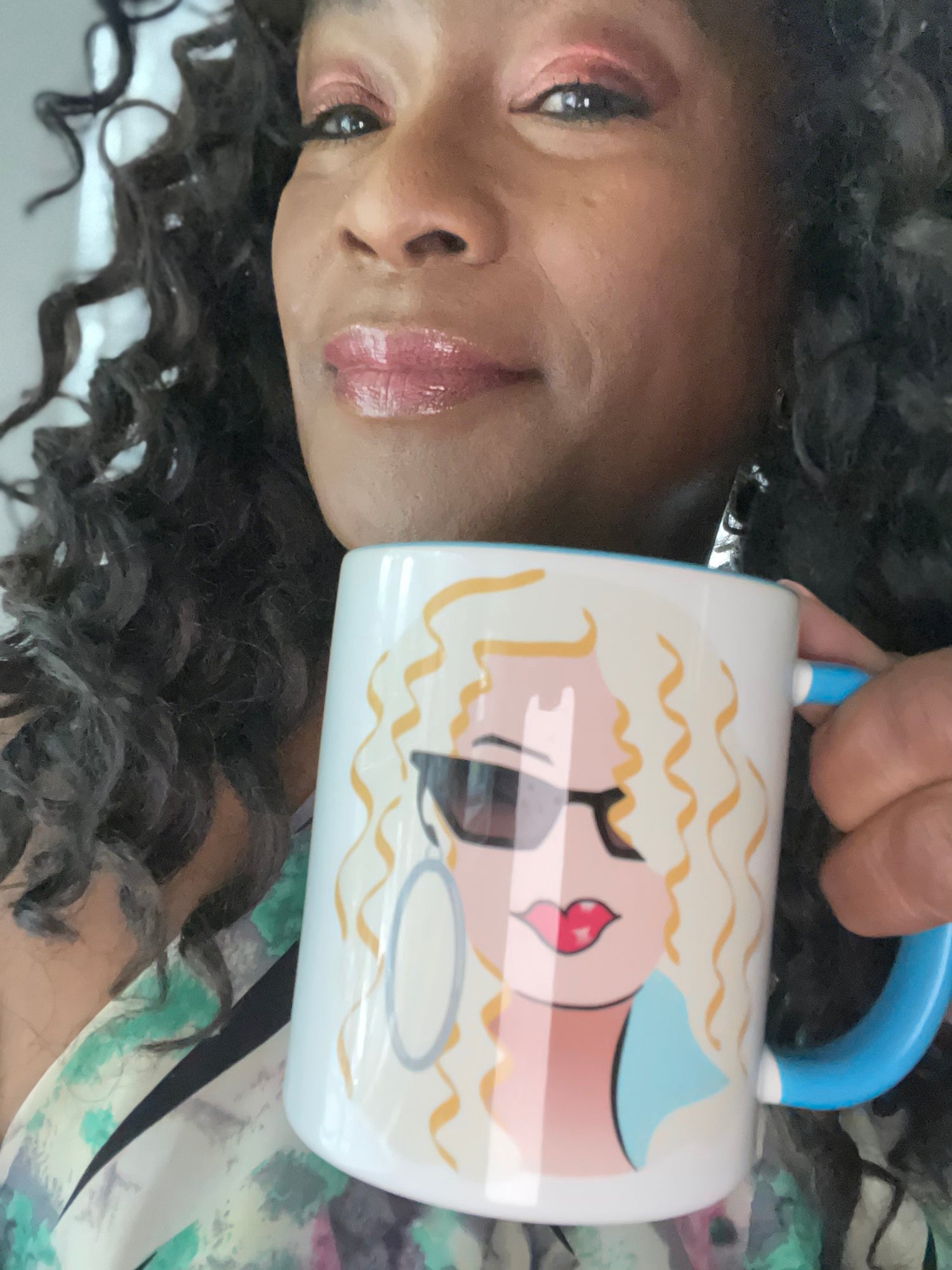 Blonde Girl with sunglasses on a blue and white coffee mug.